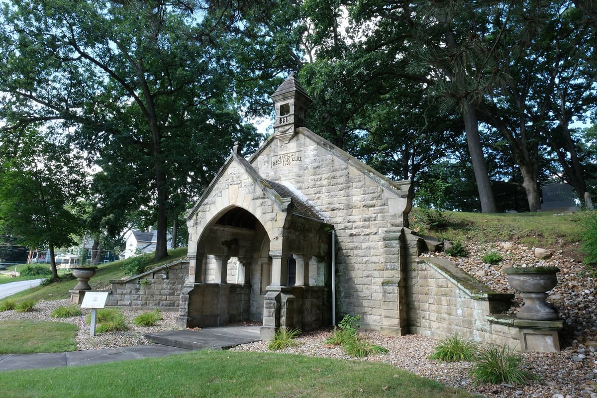 A small stone receiving vault in a cemetery