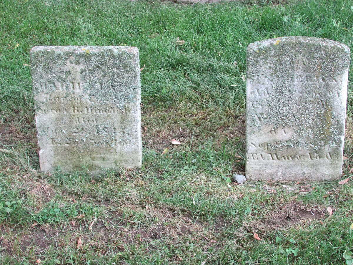 Two lichen encrusted headstones